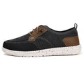 Men's black laceless canvas shoes with low-top design and round toe