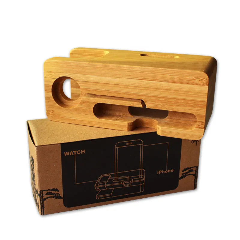 Natural bamboo smartphone stand with carved ornament detail on an office desk.