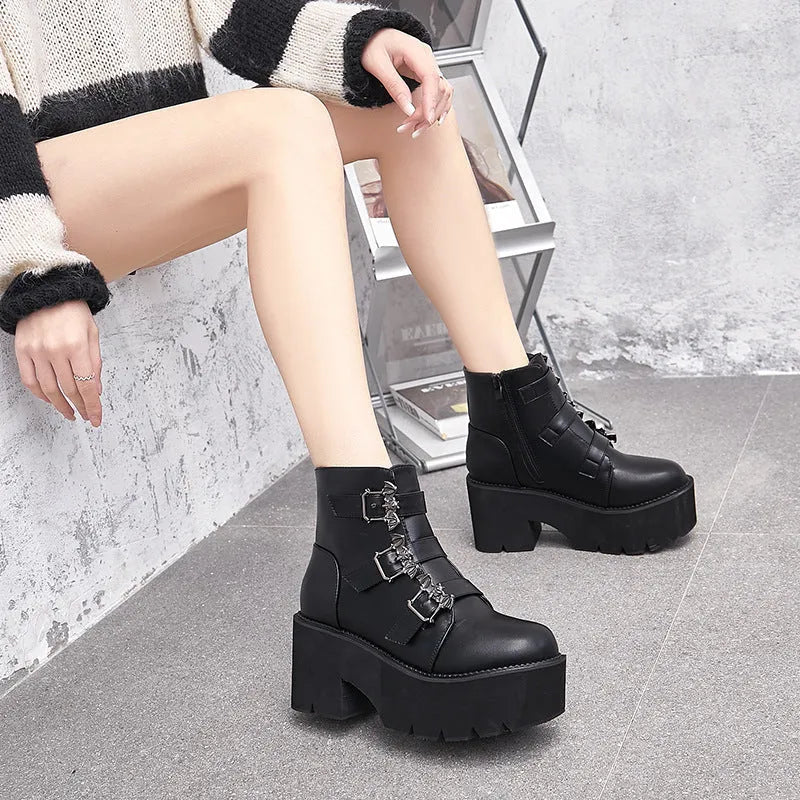 Black women's punk gothic ankle boots with bat buckle, side zip, and thick heel.