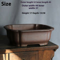 Rectangular purple sand bonsai flower pot with straight sides on a floor.