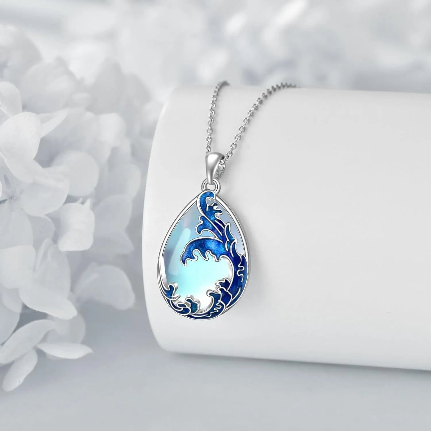 Moonstone blue heart pendant necklace with alloy chain on display