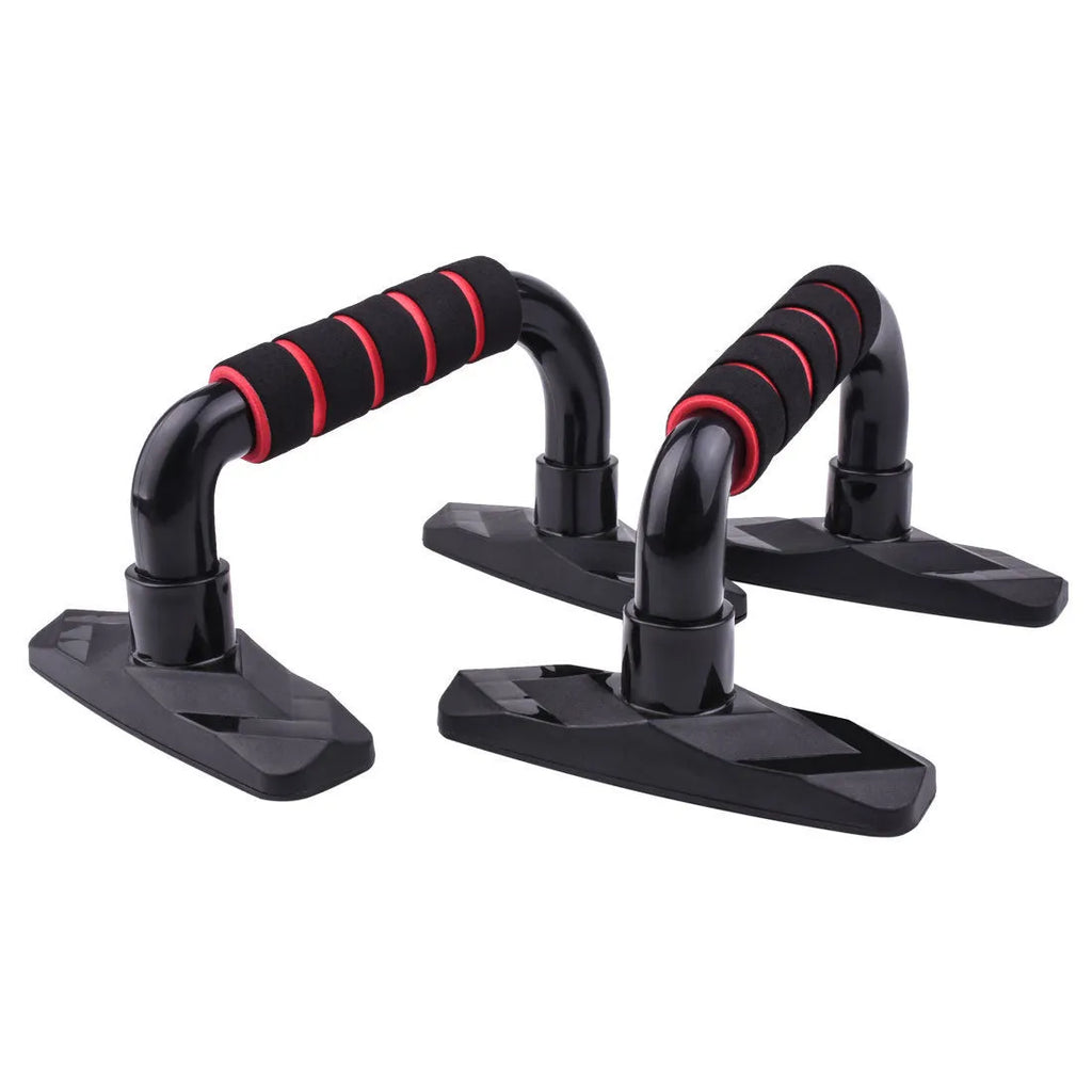 Two I-shaped black push up bars with PP sponge grips on a fitness mat.
