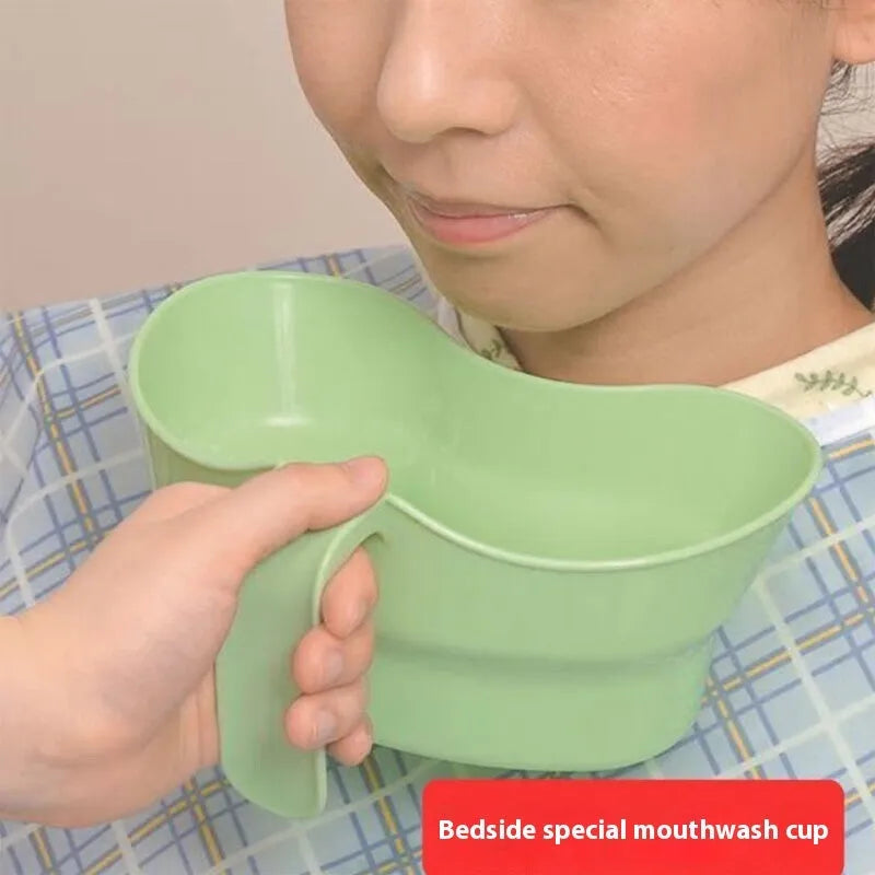 Green plastic gargle cup with spout for bedridden patient oral hygiene assistance