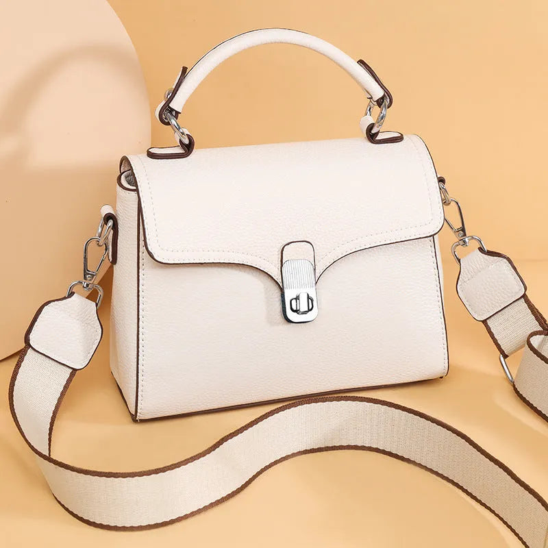 Genuine leather oval cross-body bag 21x18x9cm with sandwich pocket, shown in white, black, khaki and blue
