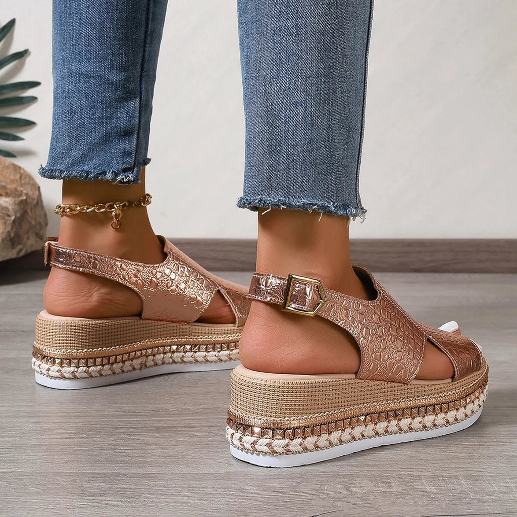 Gold women's Roman sandals with round toe, openwork design and ankle buckle strap