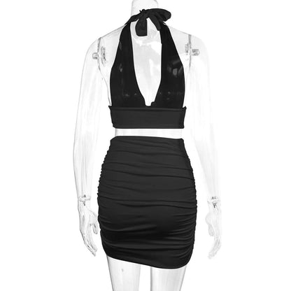 Stylish 2-piece dress set for women featuring a halter top with lace-up detail and a pleated skirt in various colors