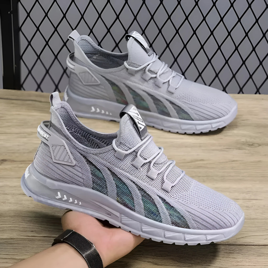 Men's low-top black mesh sneakers with stripe pattern and flat plastic sole on a white background.
