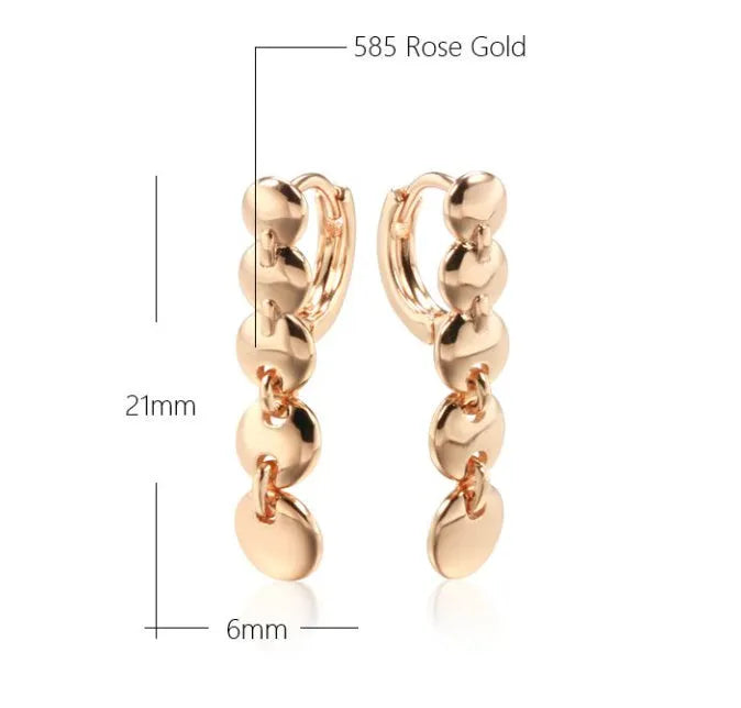 Gold-coloured retro circle earrings with woven copper construction and geometric design