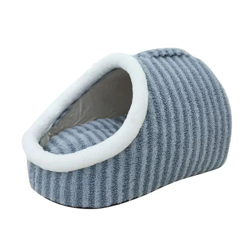 Striped thickened 3D dog bed with removable sponge mattress in blue, shown in a home setting