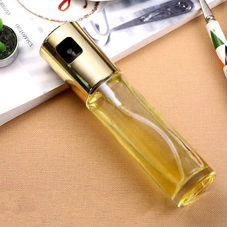 Gold push-type oil spray bottle with glass reservoir and ABS pump for BBQ and kitchen use