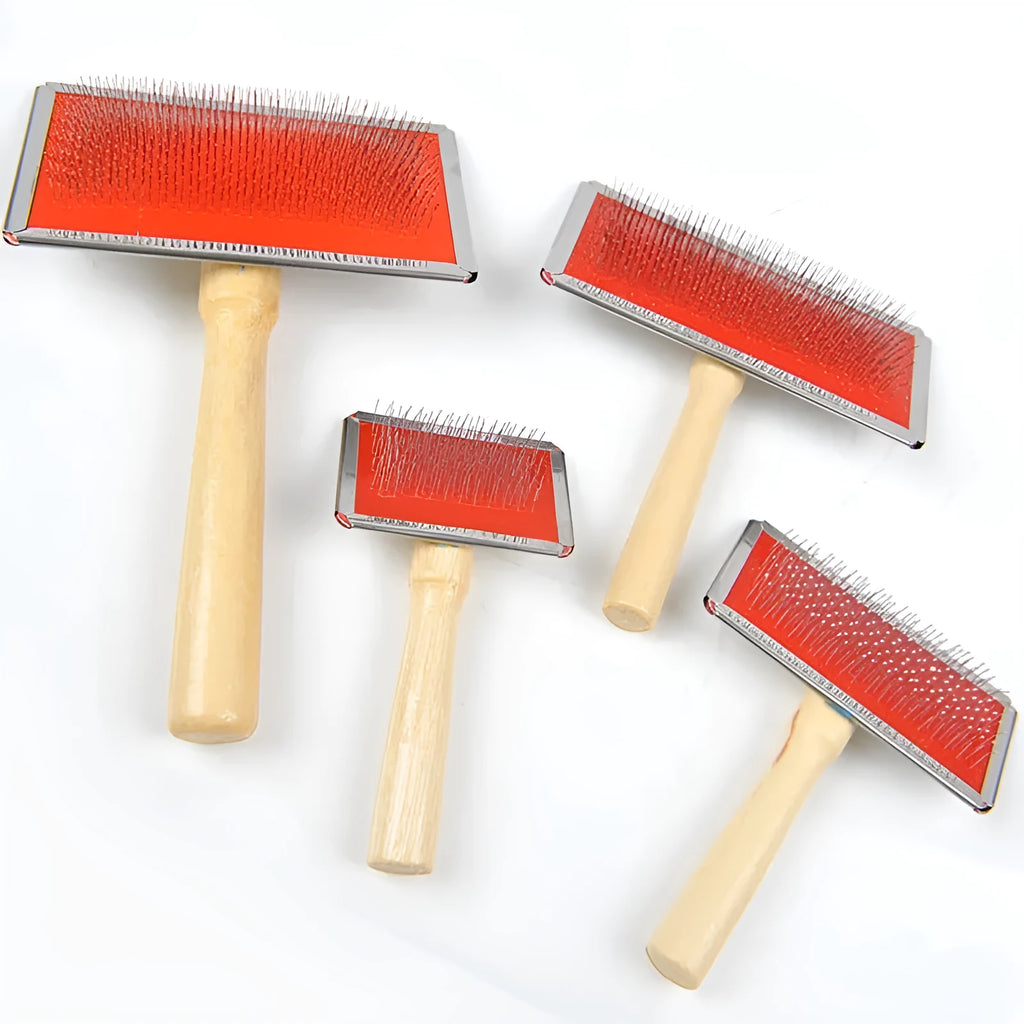 Red pet needle comb dog grooming comb with wooden handle and stainless steel plate on a neutral background
