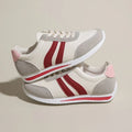 Blue lace-up leisure sneaker with soft bottom and rubber sole on white background