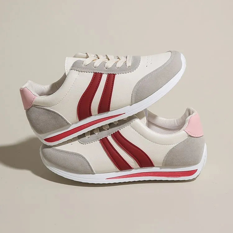 Blue lace-up leisure sneaker with soft bottom and rubber sole on white background