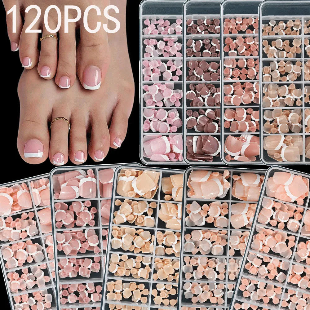 120 piece box of French white edge full square short nude artificial nail tips in nine shades.