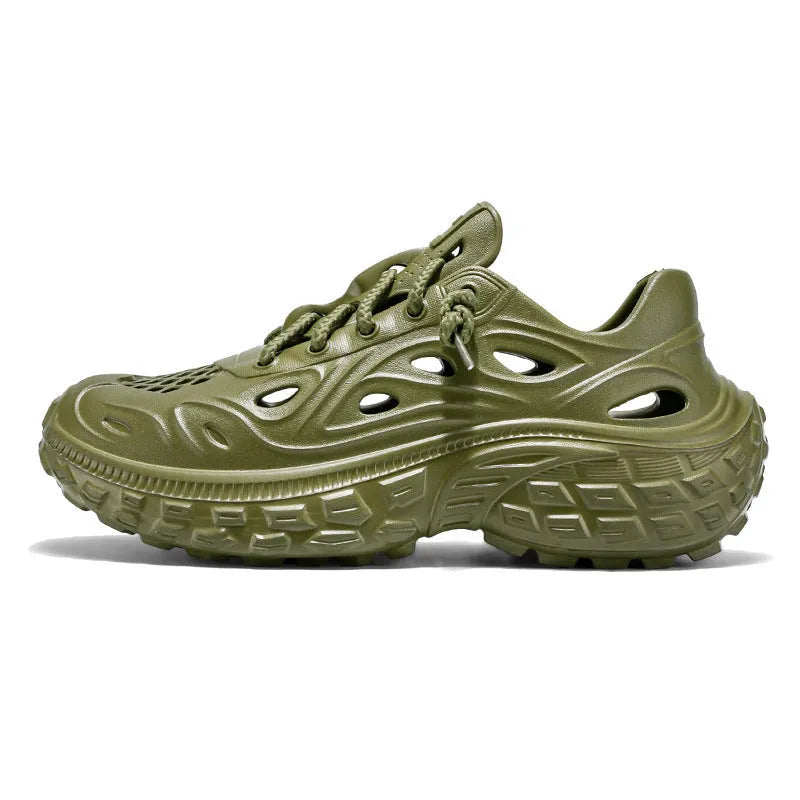 Men's black EVA sandals with a hollow out design and thick sole, shown on a foot.