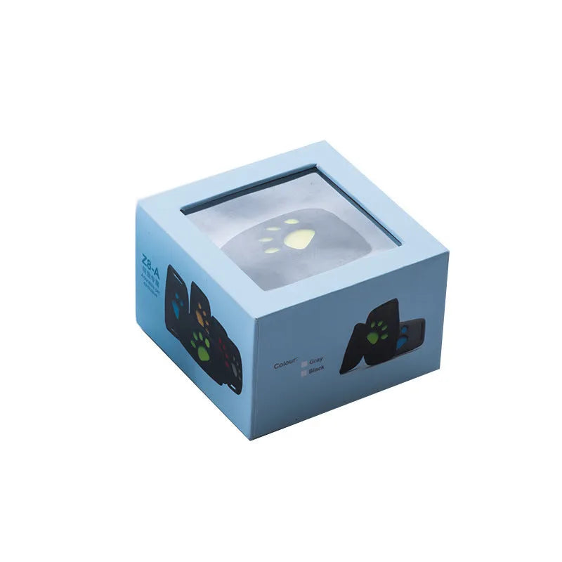 Waterproof GPS pet tracker device in multiple colours showing compact size