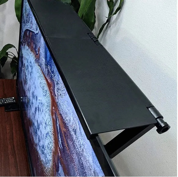 Black adjustable screen top shelf, 13-inch wide, mounted on TV, holding streaming device and remote