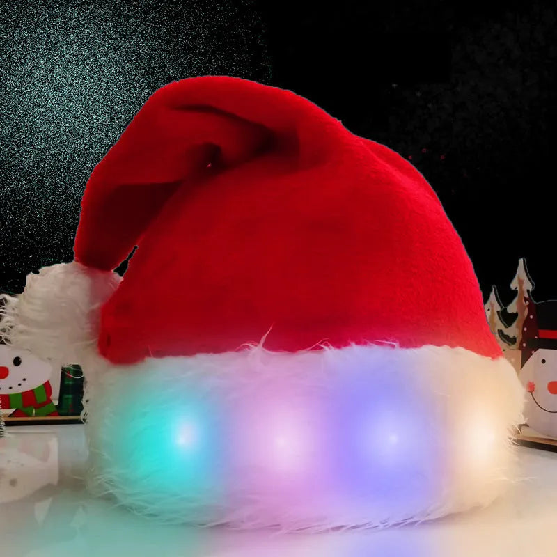 Red and white plush Santa hat with glowing LED lights and a white pom-pom, shown on a person's head.