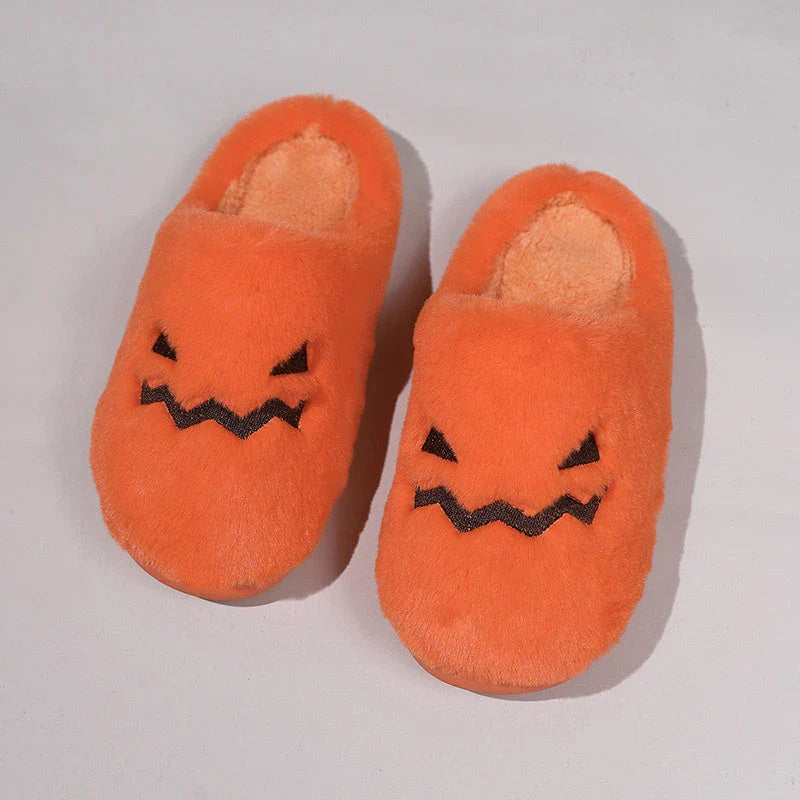 Cozy pumpkin-themed slippers with plush coral velvet upper and non-slip PVC sole for comfortable indoor wear