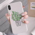 White silicone iPhone case with a detailed painted botanical plant design on the back.