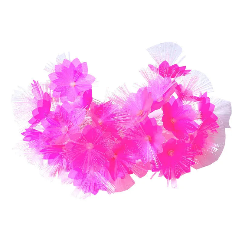 LED optical fibre flower light string with 20 warm white flower-shaped beads on a dark background