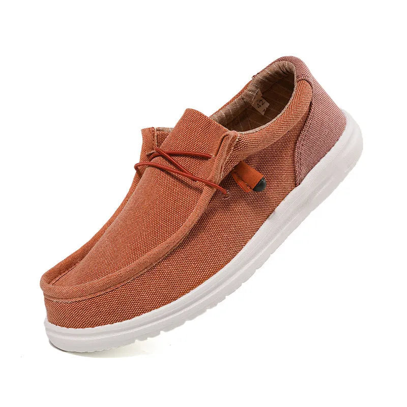 Men's green and orange canvas casual shoes with mosaic pattern detailing and rubber soles