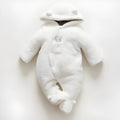 Baby wearing a brown cotton padded winter jumpsuit with long sleeves