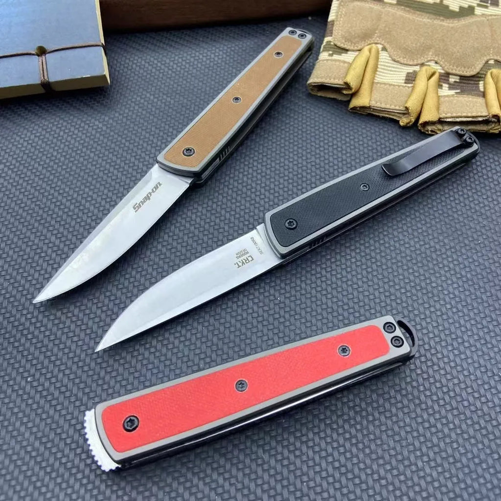Folding fruit knife with stainless steel blade shown in black, red, and coffee colour variations