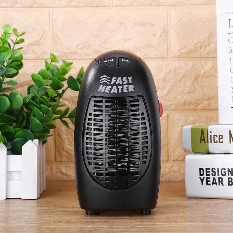 Black portable mini ceramic electric heater with digital display and a rotating plug on a white background.