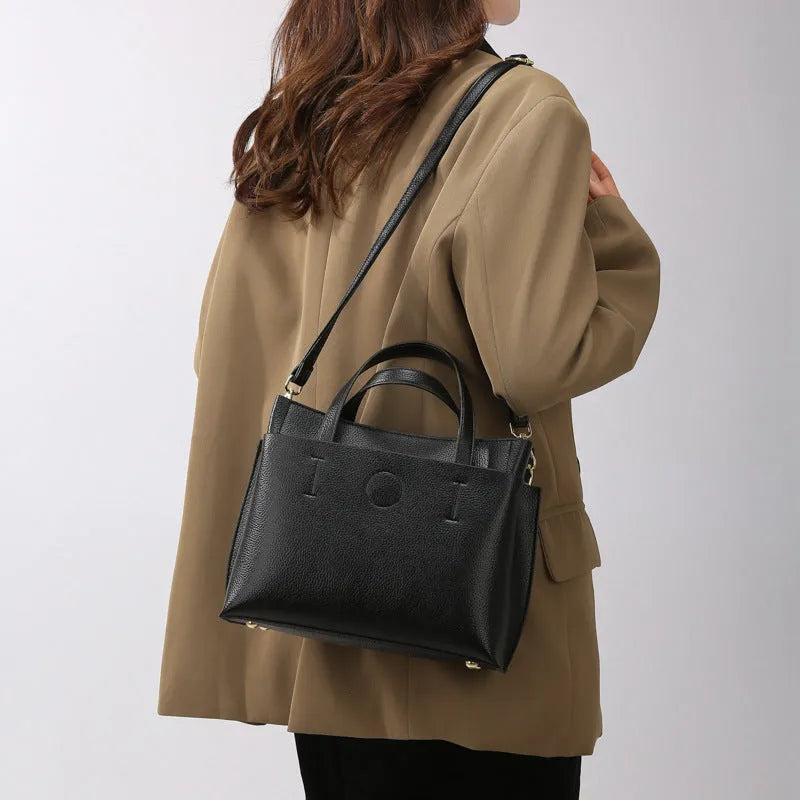 Large capacity multi-compartment soft surface PU tote bag in khaki with sewing thread details and single shoulder strap