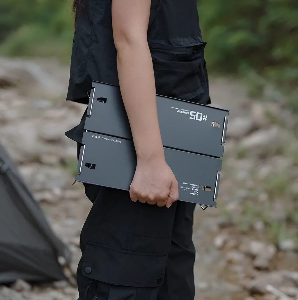 Aluminium alloy camping folding table shown in a folded position, available in black or grey colour.
