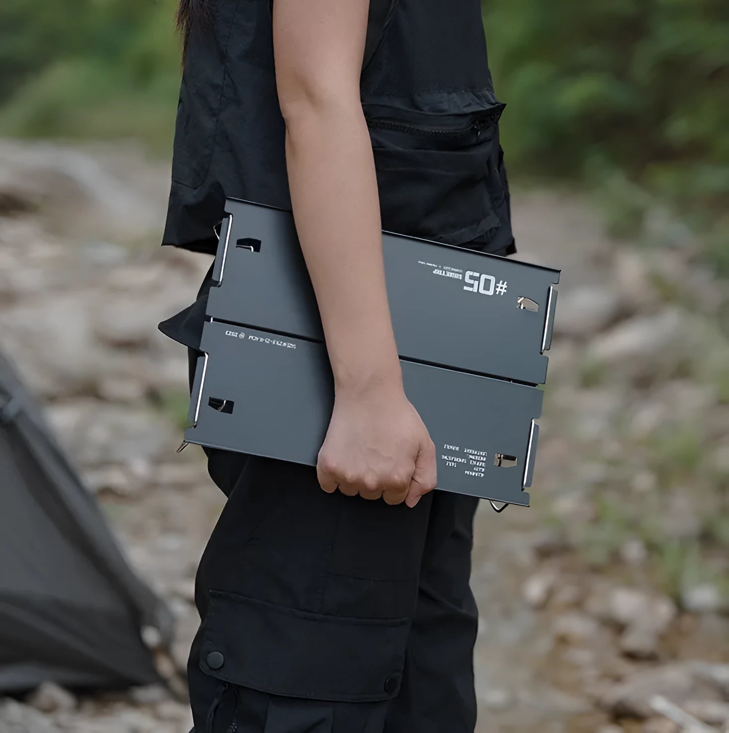 Aluminium alloy camping folding table shown in a folded position, available in black or grey colour.