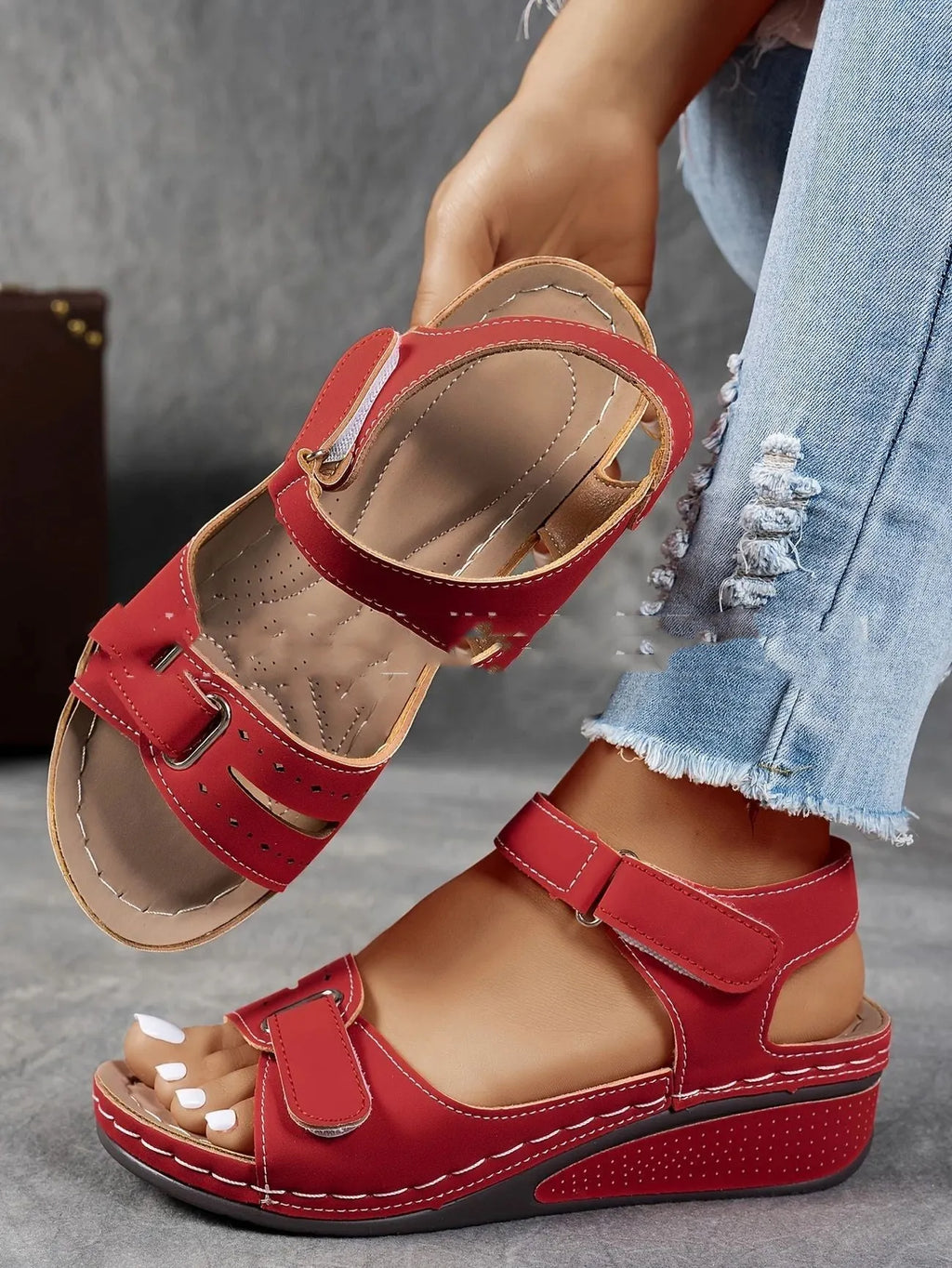 Women's beige plus size sandals with a thick composite sole and an adjustable Velcro strap fastener.