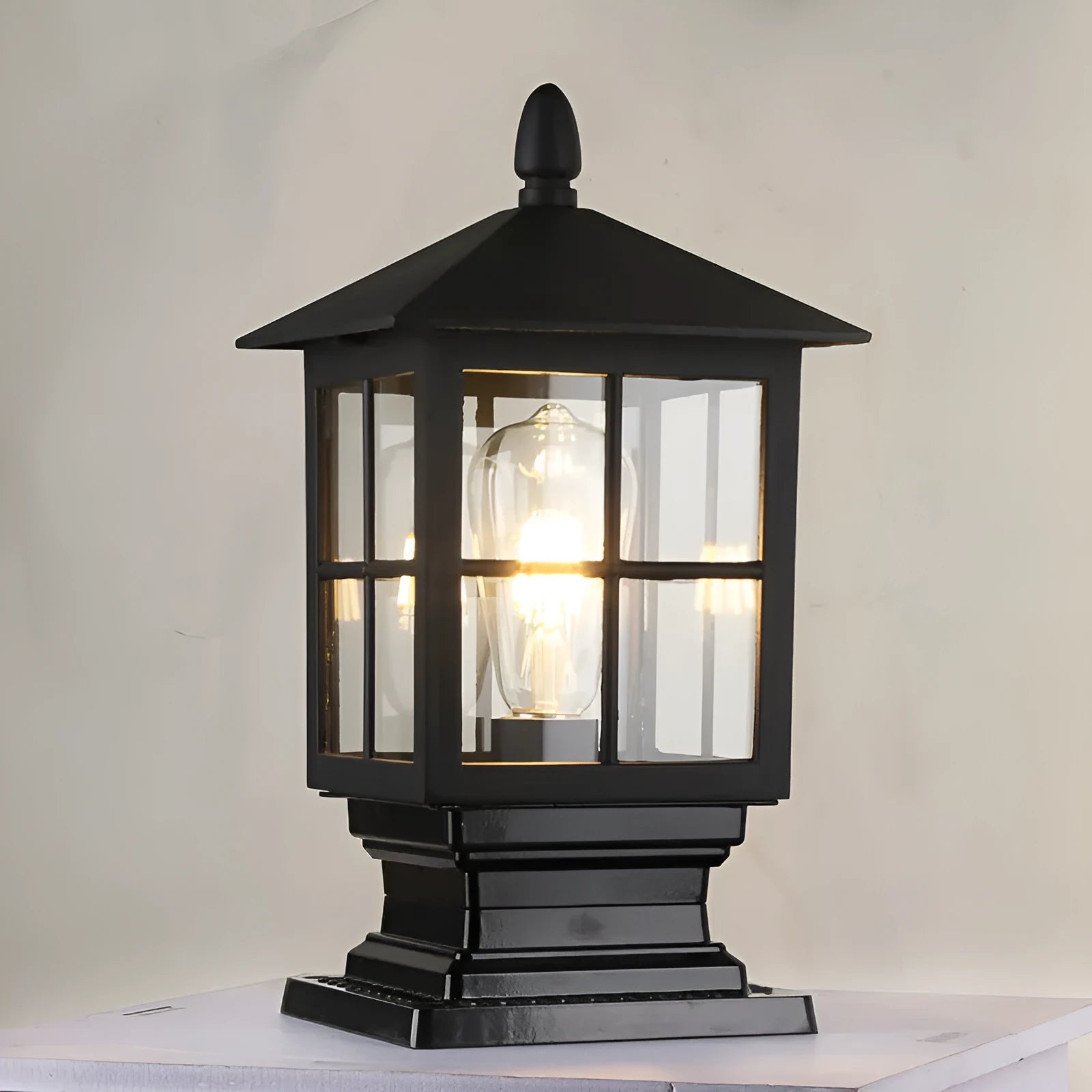 Black outdoor alloy pillar lamp on a brick wall, 180x345mm waterproof lighting fixture
