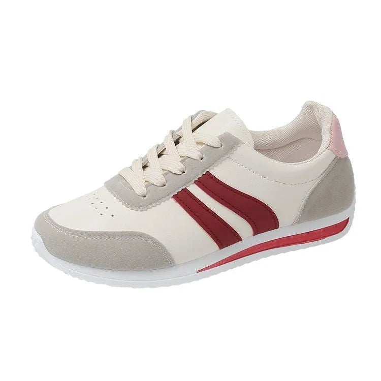 Blue lace-up leisure sneaker with soft bottom and rubber sole on white background
