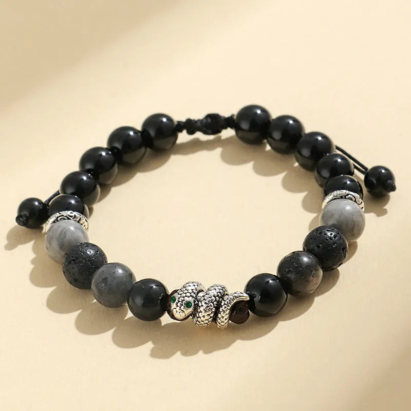 A matching couple bracelet set: one black agate and one white agate bracelet with snake chain clasps.