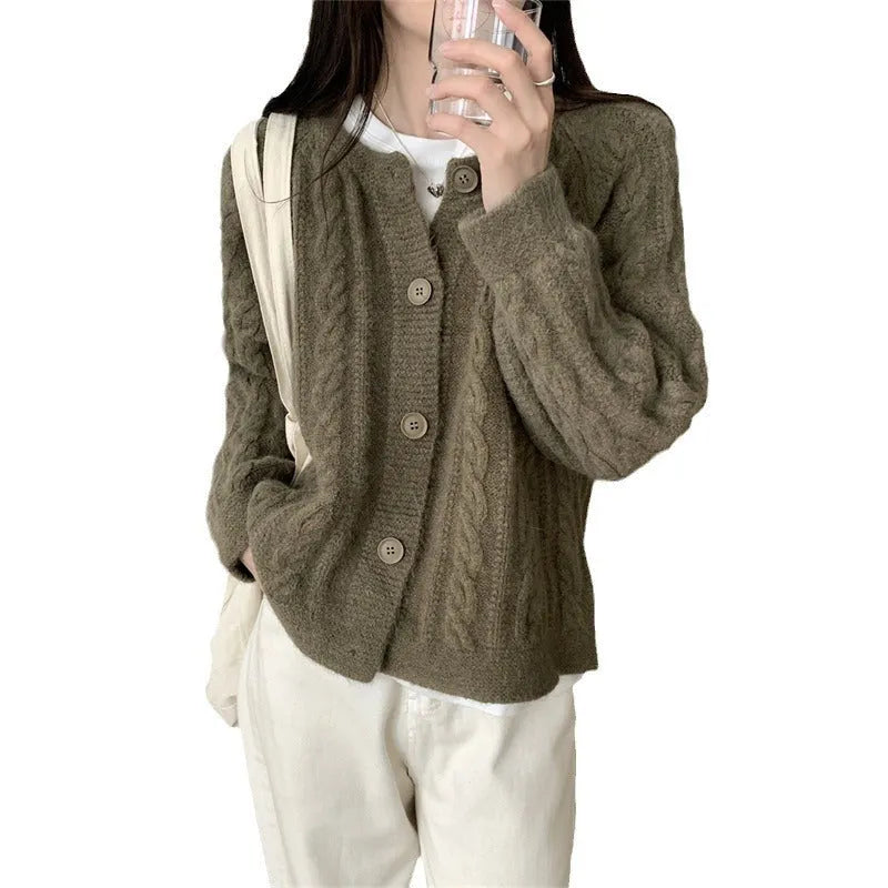 Women's loose-fit twist knit cardigan in solid colour with button front on a model