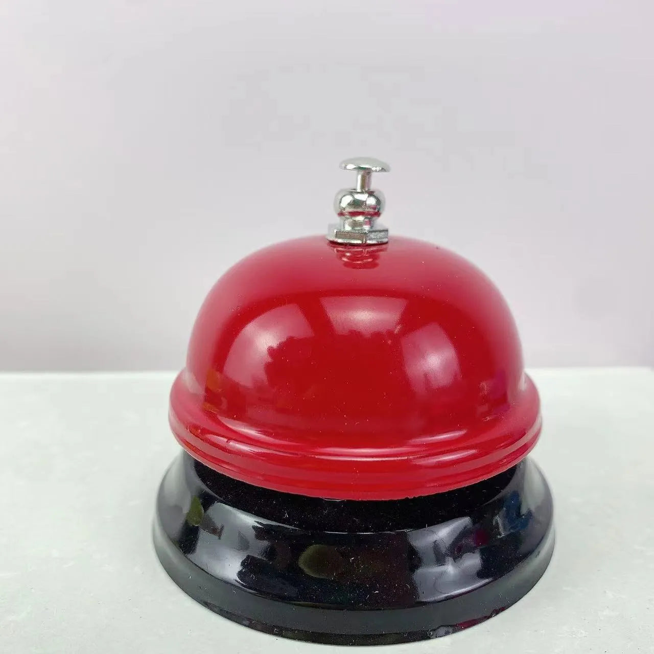 Iron game bell in various colours including red me and rose kiss options