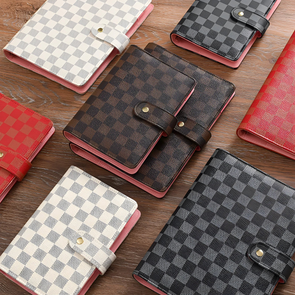 Red checkered imitation leather loose-leaf notebook in A5 size, showing the binding mechanism.