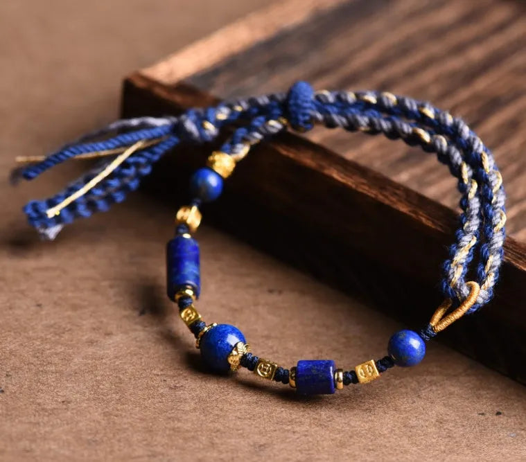 Close-up of a hand-woven flexible wire bracelet for women with a Lapis Lazuli stone accent.