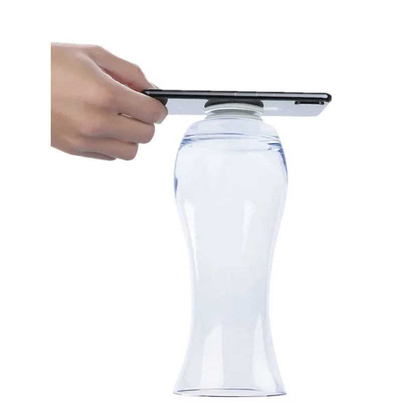 Transparent reusable nano gel adhesive pads in circular and square shapes on a smooth surface