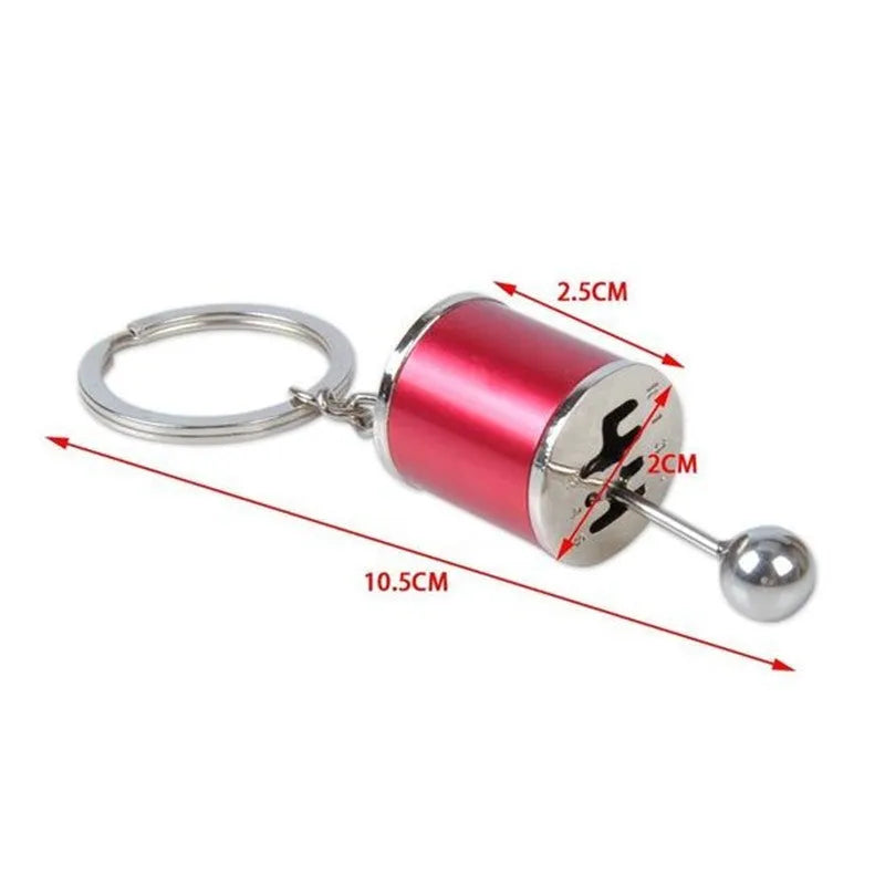 Metal gear shift keychain in polished silver with movable 6-speed and reverse lever