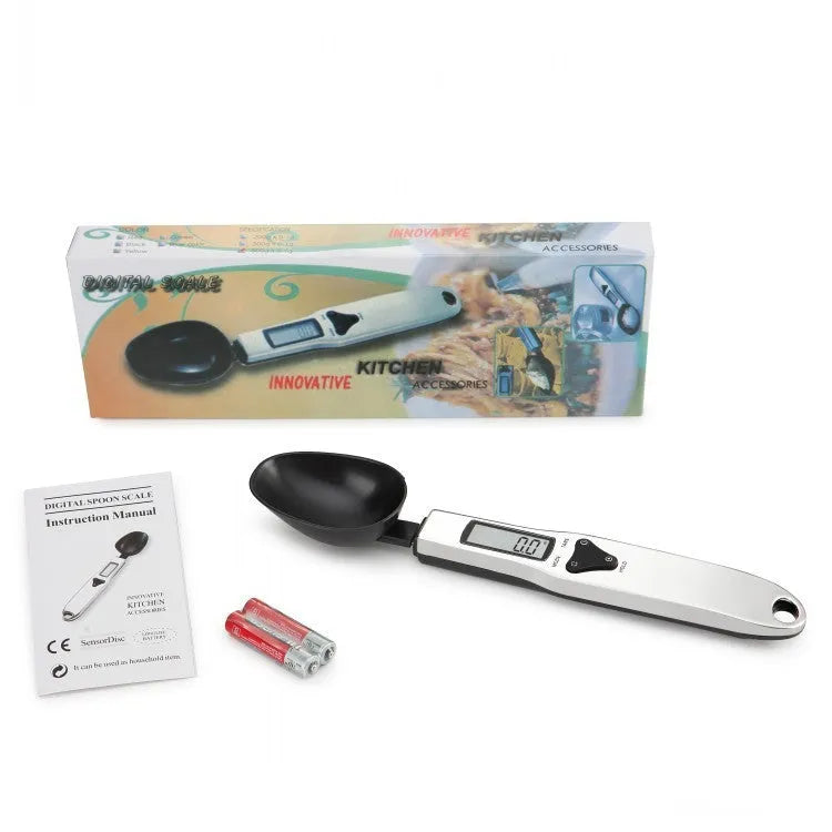 Digital kitchen measuring spoon with LCD screen showing weight measurement