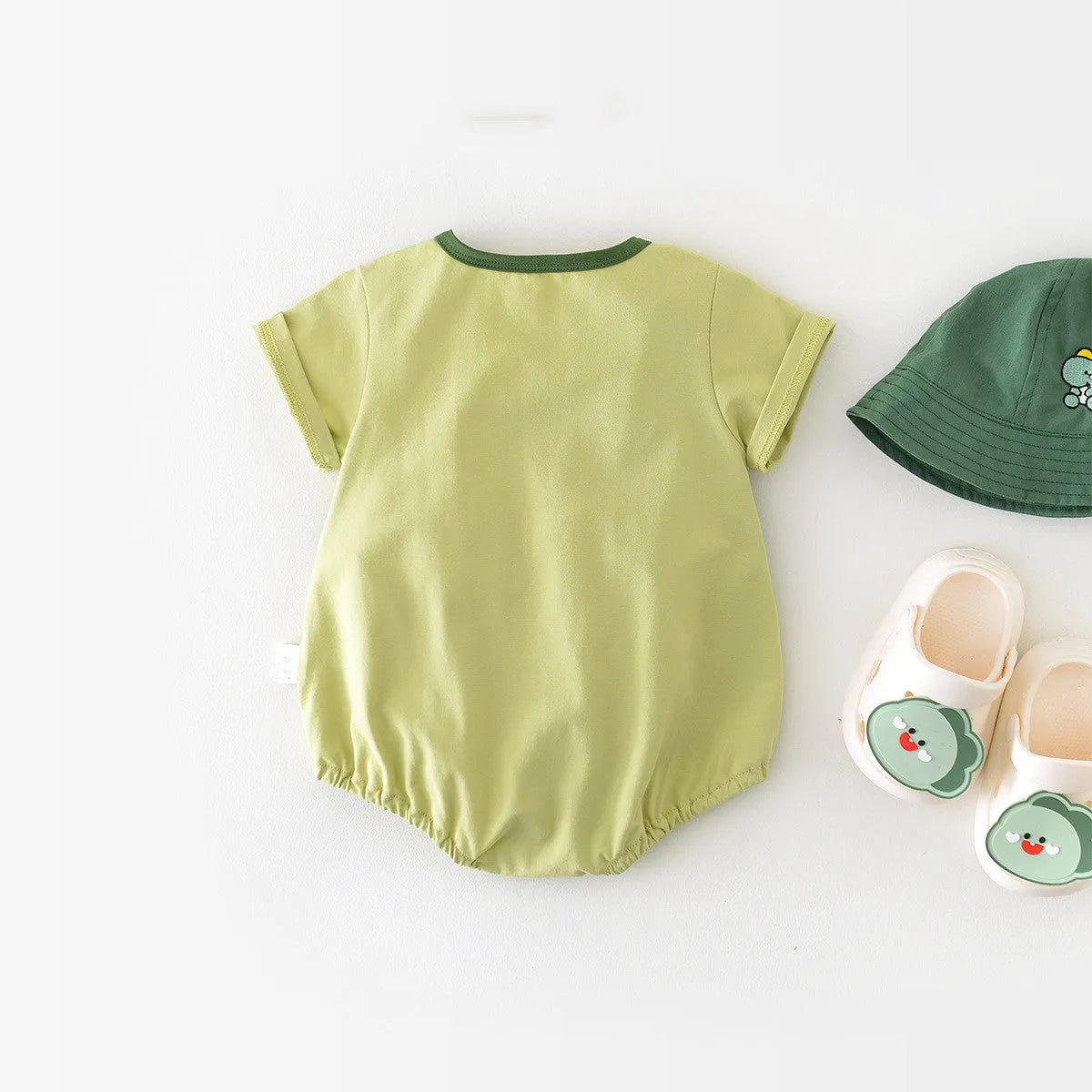 Light green cotton cartoon dinosaur full moon jumpsuit for infants with pullover closure