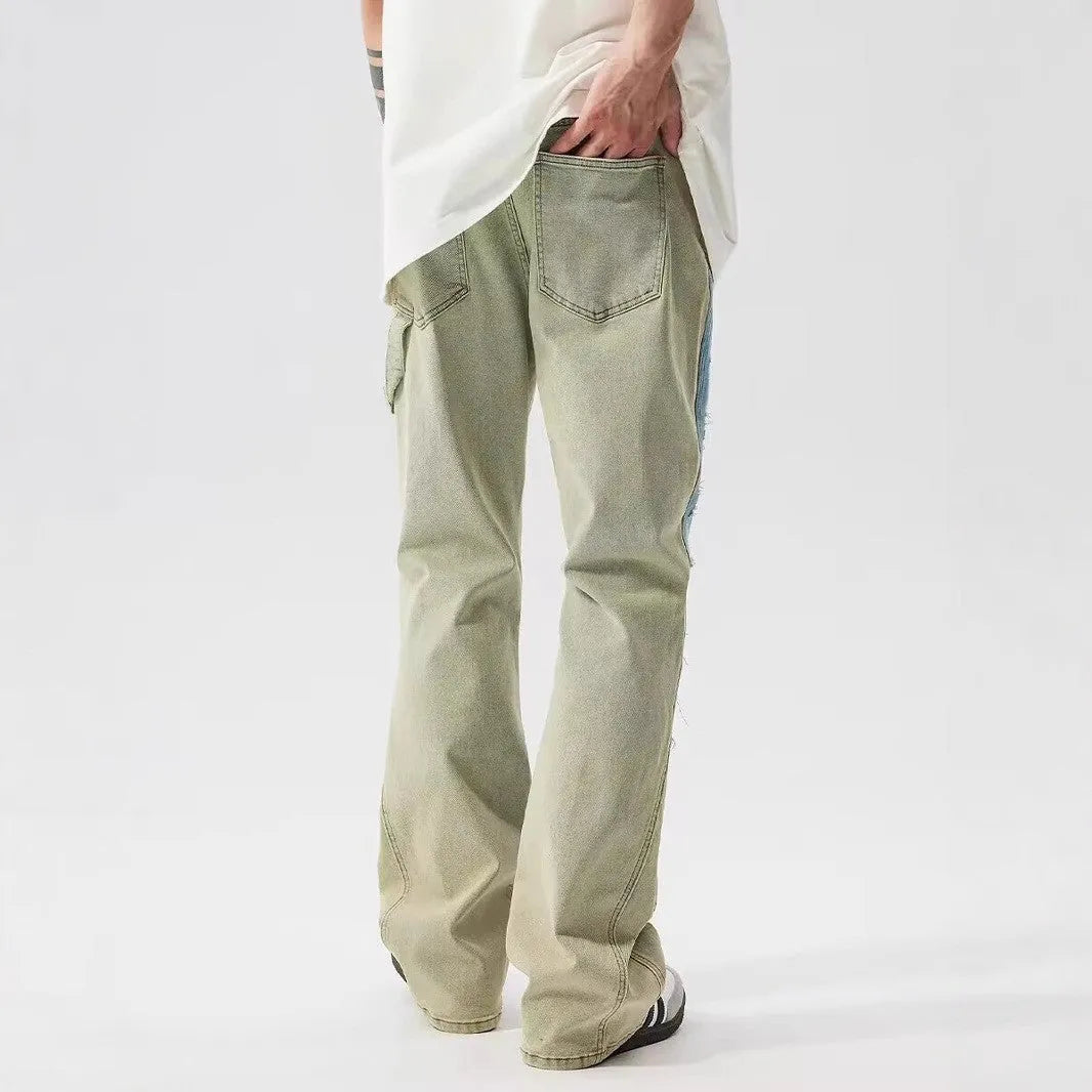 Retro yellow and blue patchwork jeans with splash-ink and damaged design details.