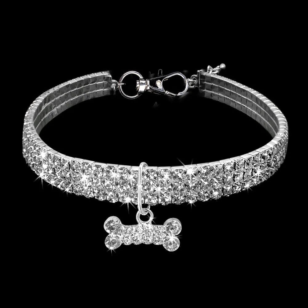 Alloy dog necklace in white with adjustable chain on a light background, three size options available