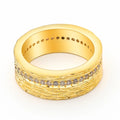 Gold coloured geometric zircon ring for women on a plain background.