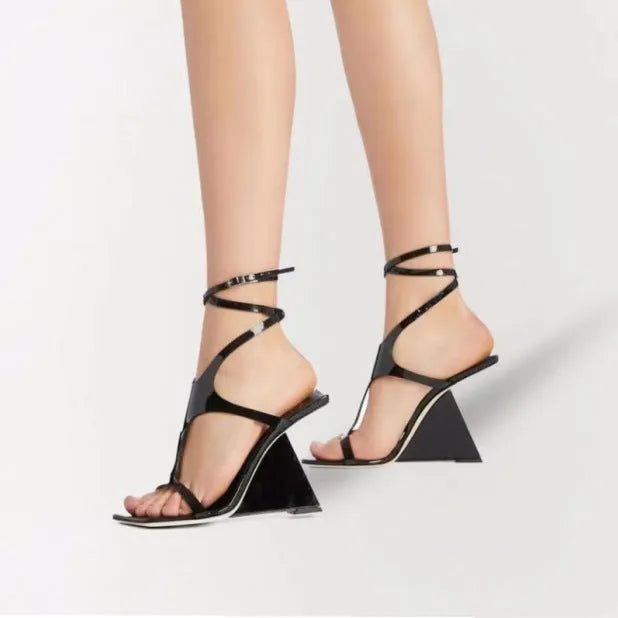 Women's black high heel sandals with a 9.5cm block heel and square toe design on a white background.