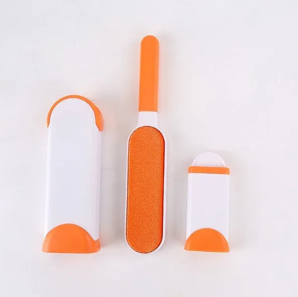 Blue self-cleaning pet hair remover brush with double-sided roller next to its cleaning base.