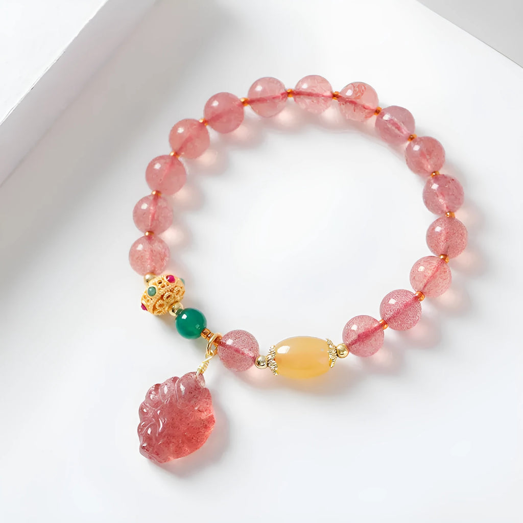 Polished crystal strawberry quartz beaded bracelet in a Nine Tail Fox style for women.